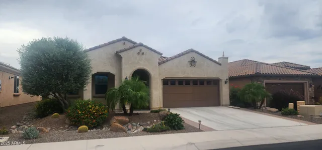 front view of a house with potted plants