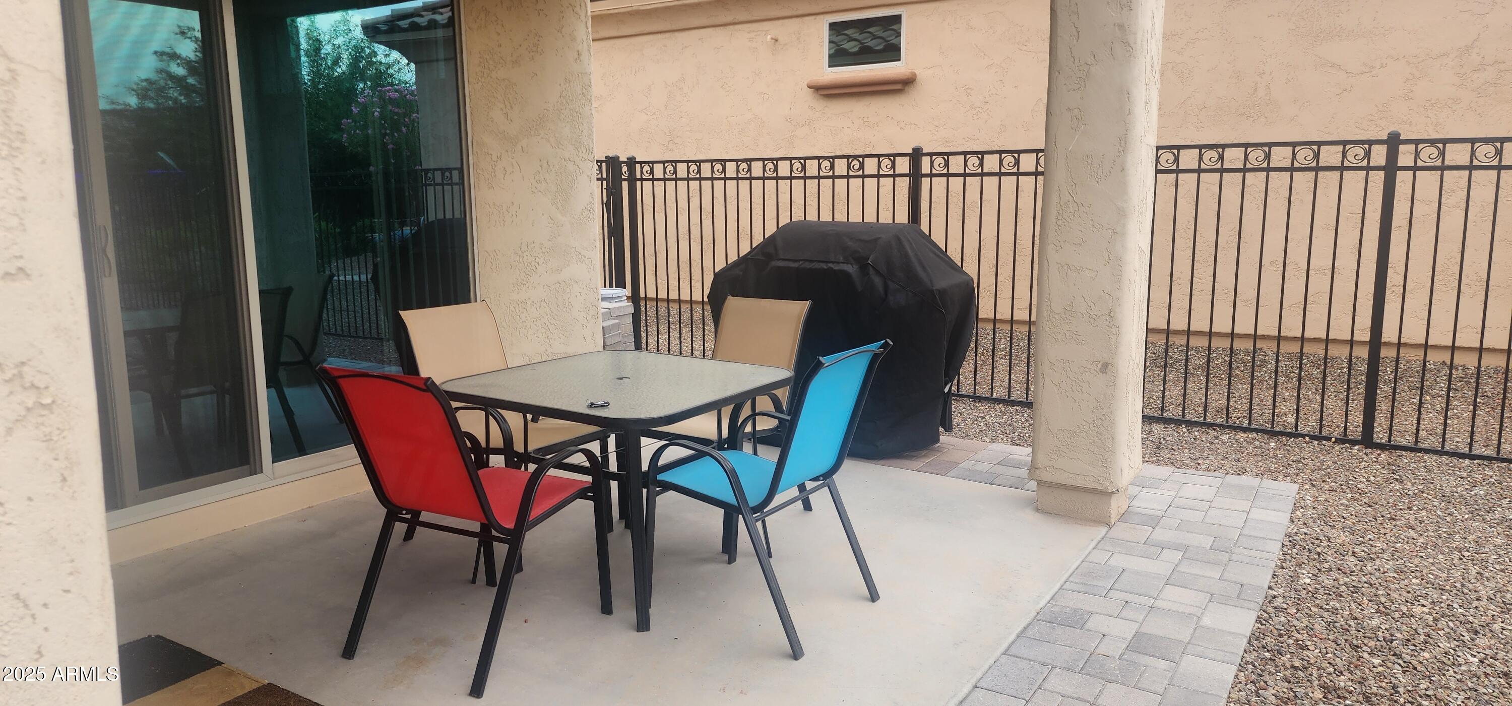 20602 North 274th Avenue Buckeye, AZ 85396 - Photo 13 of 22 a view of a chairs and table in the balcony