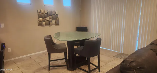 a view of a workspace with furniture