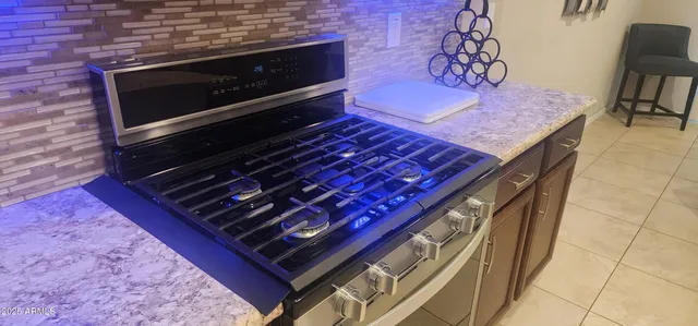 a kitchen with a stove and a microwave