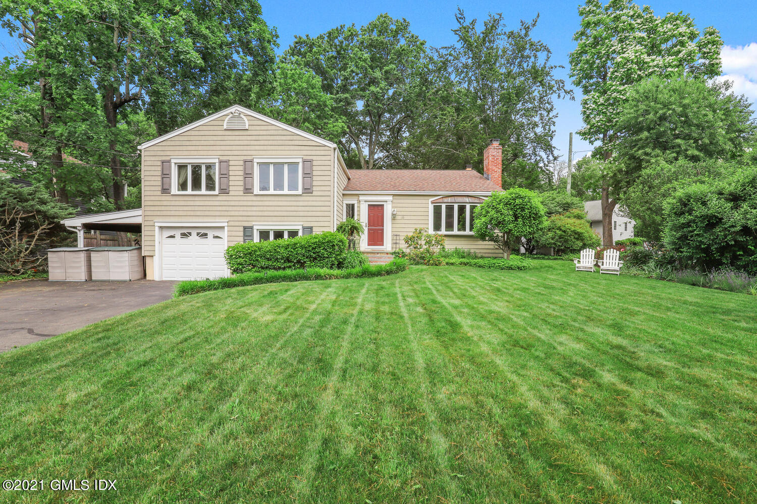 33 Mary Lane Riverside, CT 06878 - Photo 1 of 34 a front view of a house with a yard