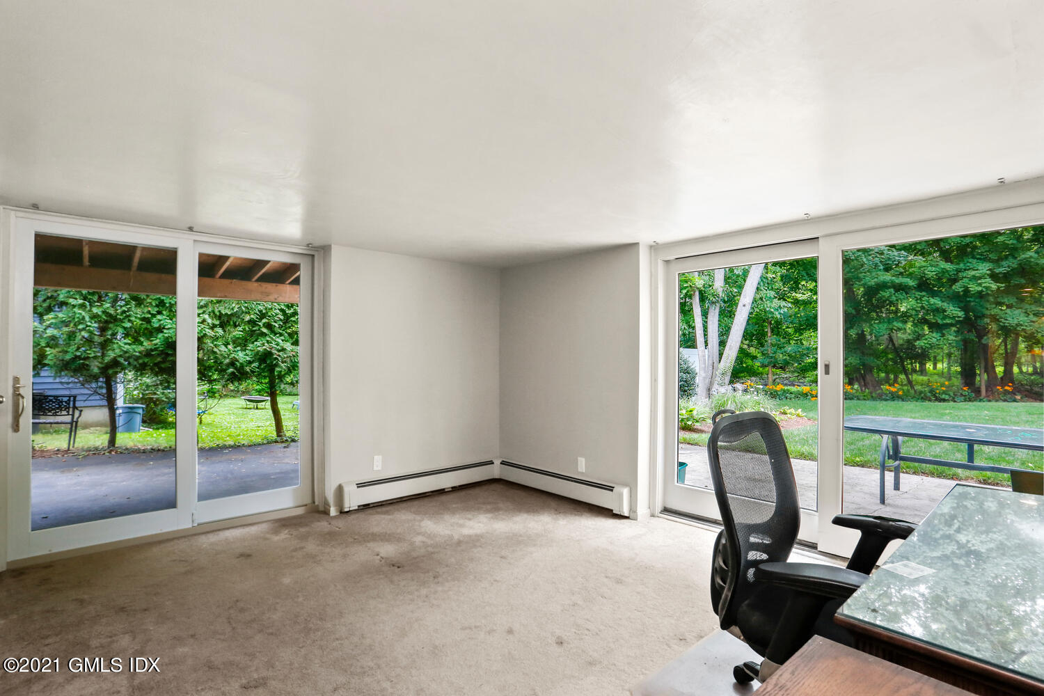 33 Mary Lane Riverside, CT 06878 - Photo 19 of 34 a view of a room with porch and wooden floor