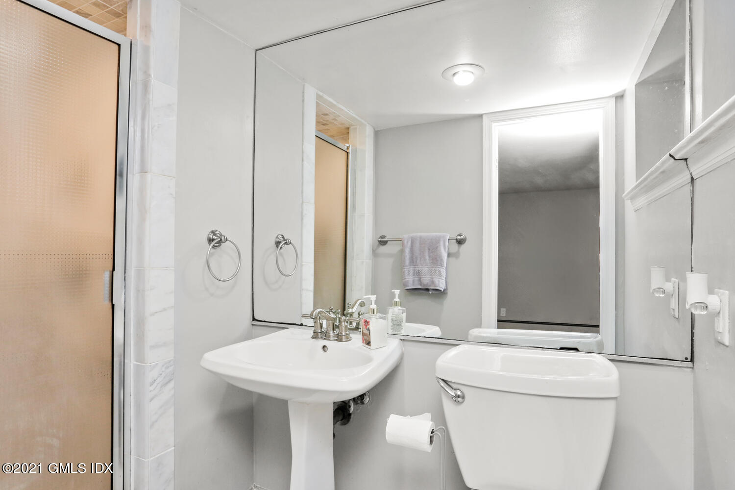 33 Mary Lane Riverside, CT 06878 - Photo 20 of 34 a bathroom with a sink a toilet and shower