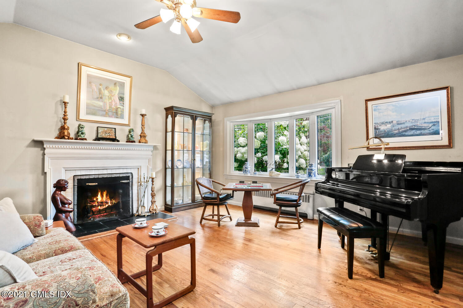 33 Mary Lane Riverside, CT 06878 - Photo 4 of 34 a living room with furniture and a fireplace