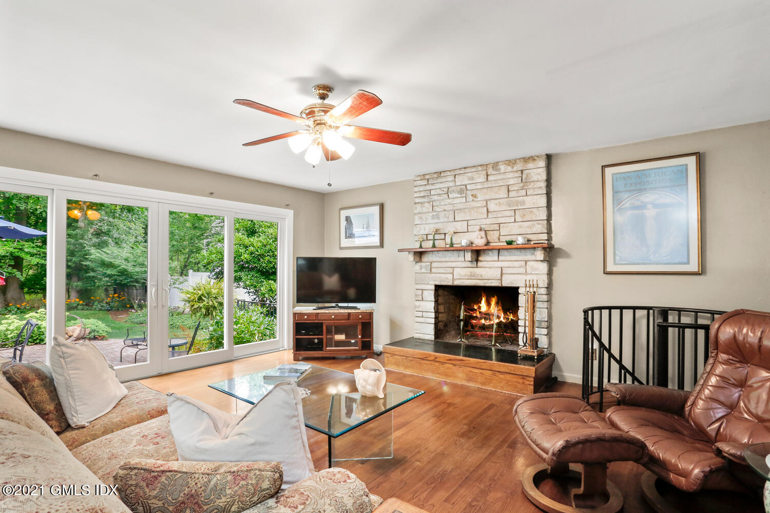 33 Mary Lane Riverside, CT 06878 - Photo 5 of 34 a living room with furniture a fireplace and a large window
