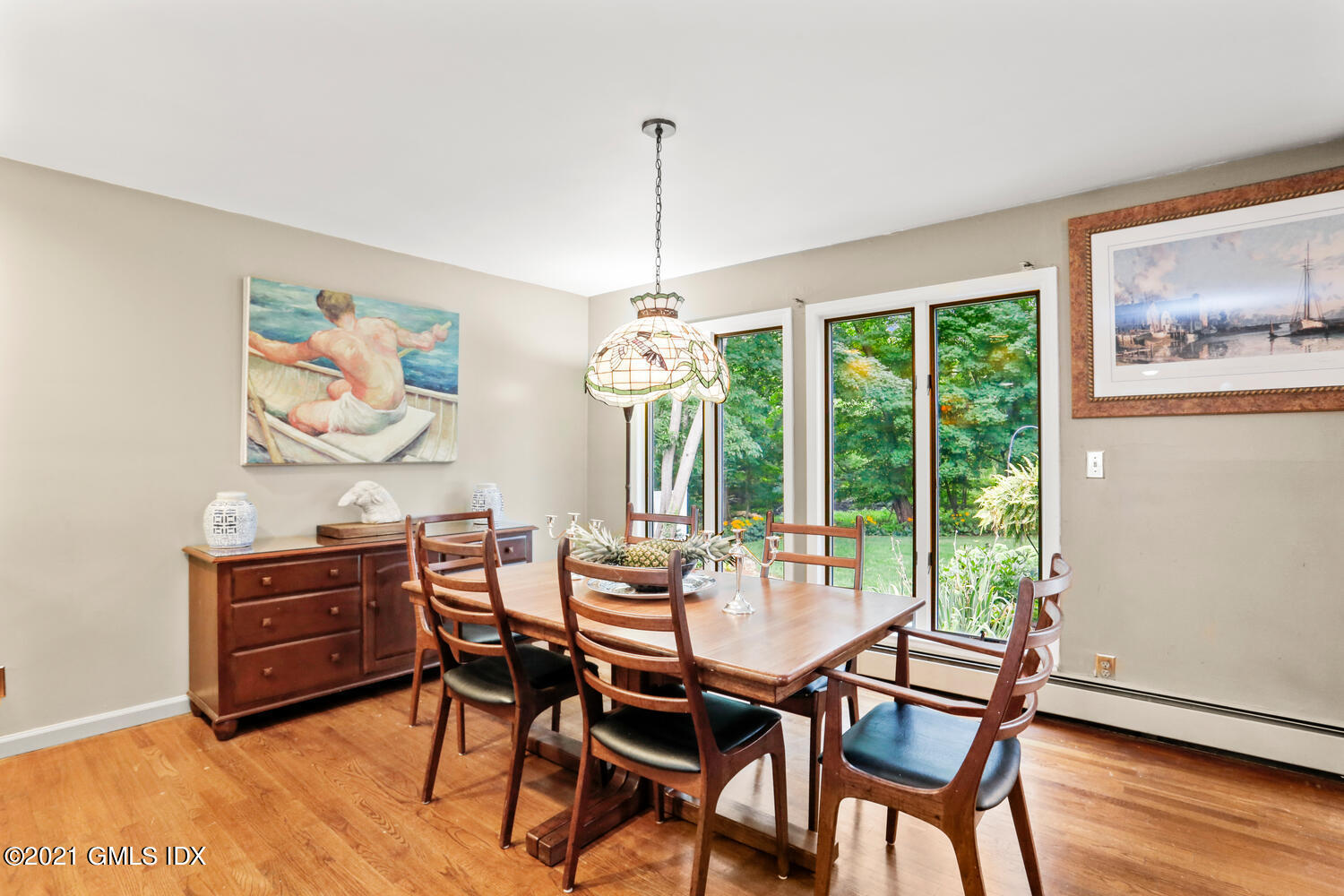 33 Mary Lane Riverside, CT 06878 - Photo 8 of 34 a dining room with furniture a chandelier and wooden floor