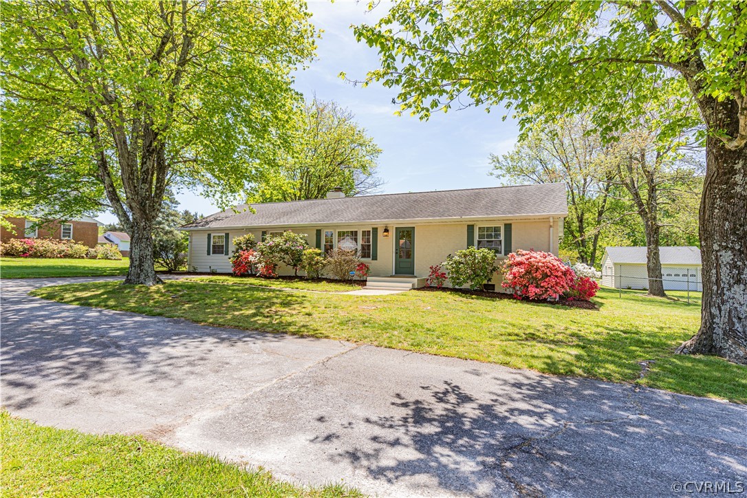 11607 Genito Road Midlothian, VA 23112 - Photo 3 of 50 a front view of a house with garden