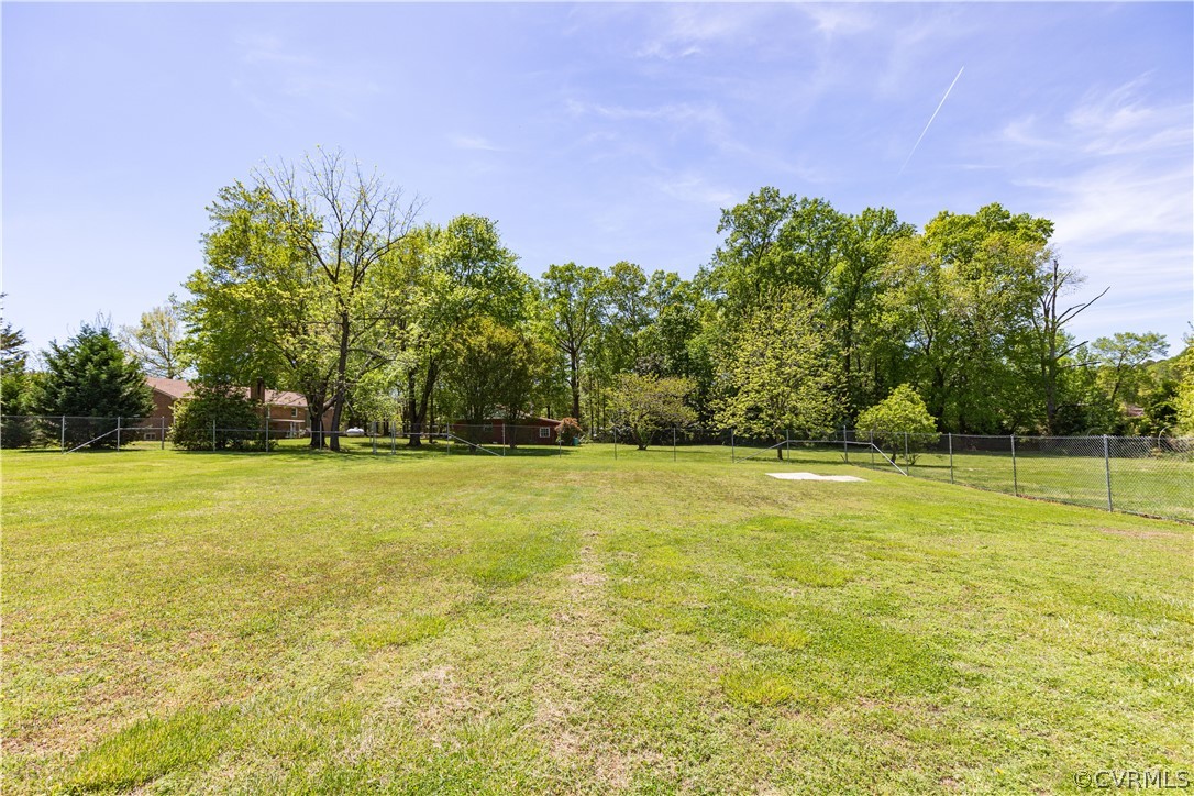 11607 Genito Road Midlothian, VA 23112 - Photo 37 of 50 a view of swimming pool and trees in the background