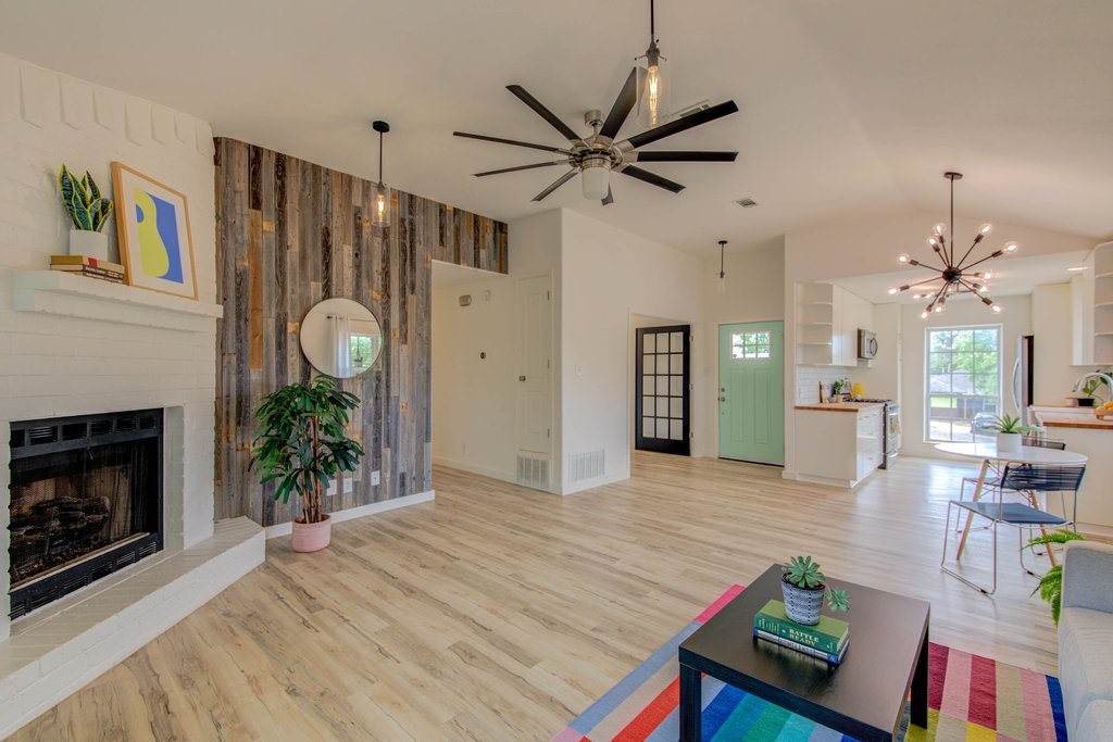 a living room with furniture and a fireplace