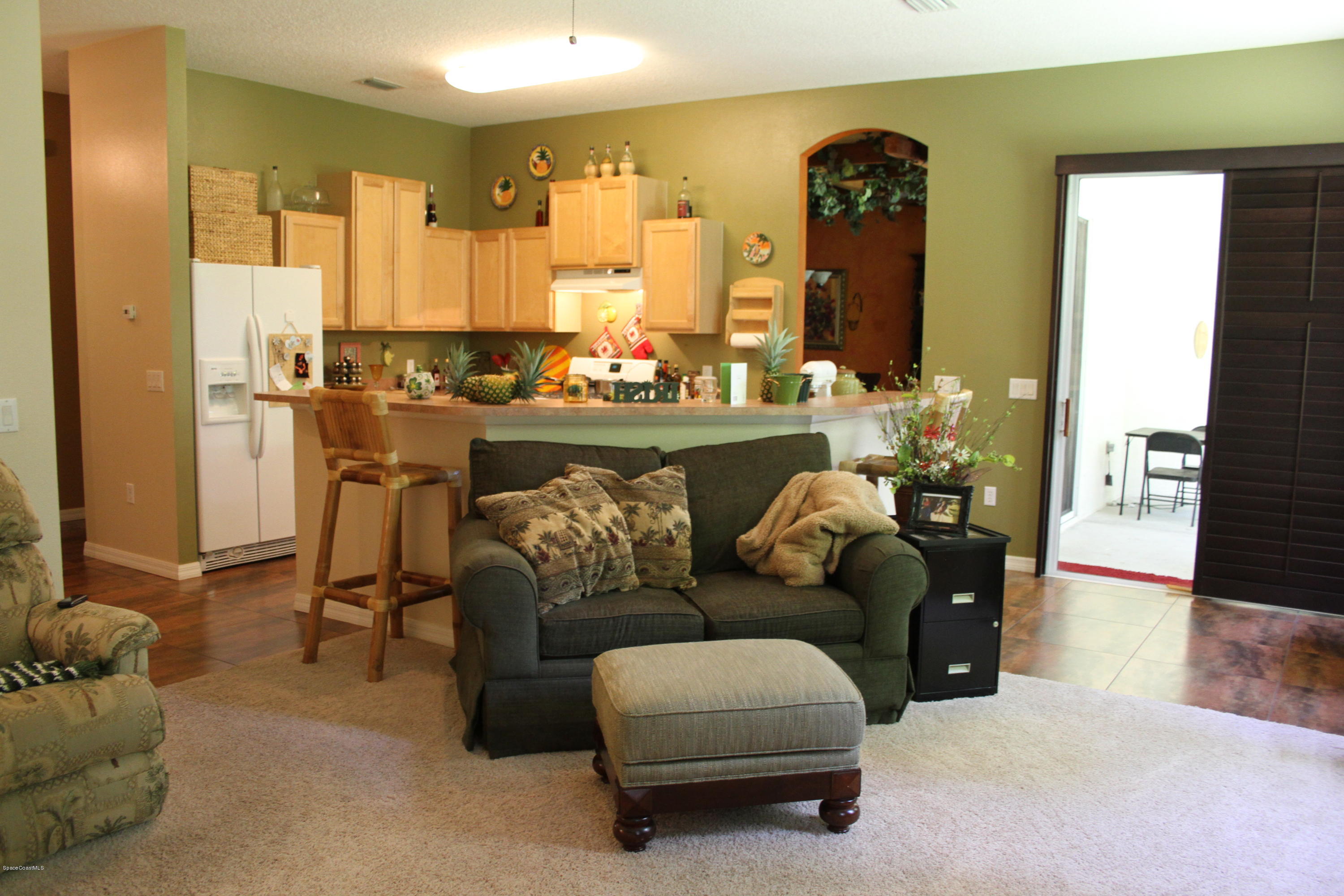 795 Seymour Road Northeast Palm Bay, FL 32905 - Photo 13 of 46 FAMILY ROOM TO KITCHEN