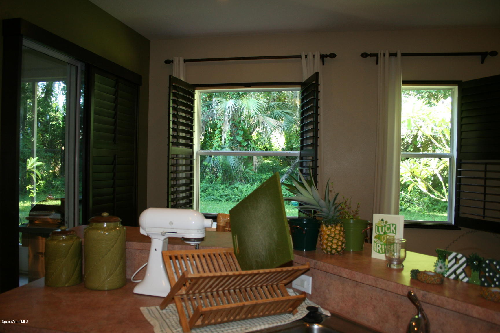 795 Seymour Road Northeast Palm Bay, FL 32905 - Photo 18 of 46 KITCHEN VIEW TO YARD