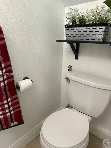 a dining room with furniture and chandelier