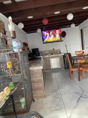 a view of a porch with furniture and next to a yard