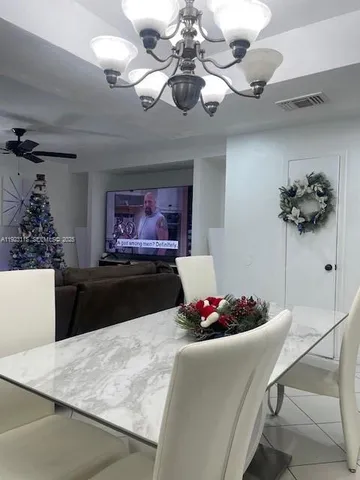 a bed sitting in a bedroom next to a bathroom