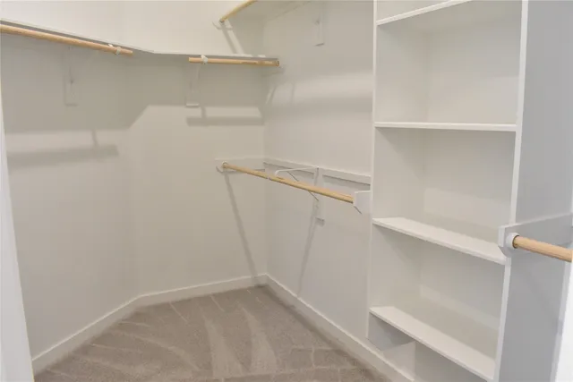 a view of an empty walk in closet