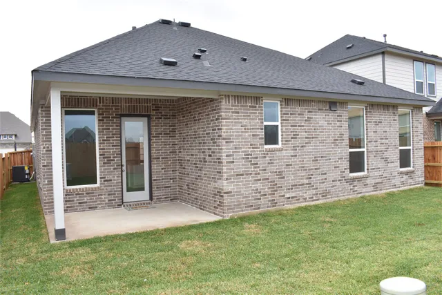 a brick house with a yard