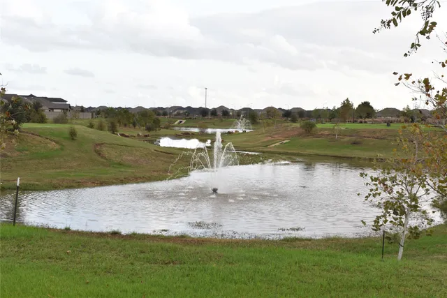 a view of a lake with a big yard