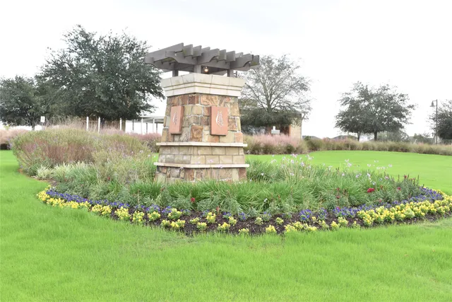 a view of a patio with a table and chairs