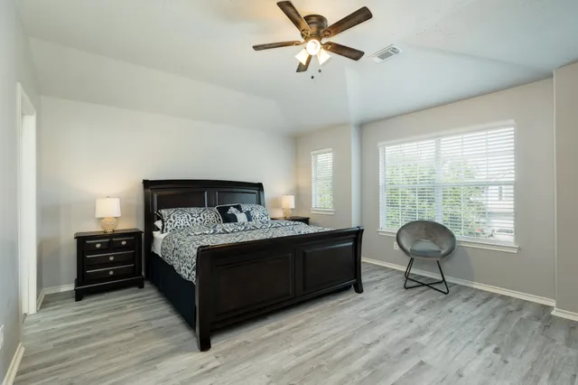 a bedroom with a bed and window