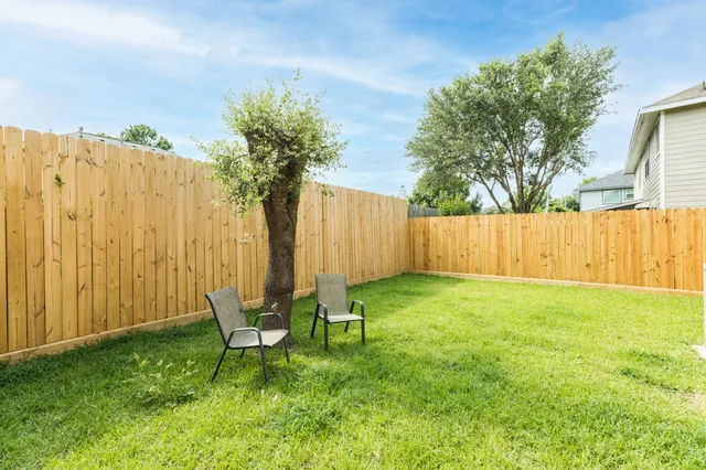 a garden with wooden fence