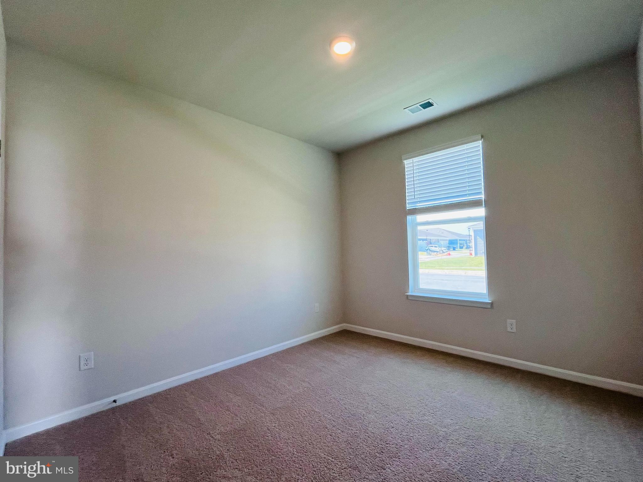 120 Ridgley Boulevard Dover, DE 19904 - Photo 9 of 17 an empty room with a window
