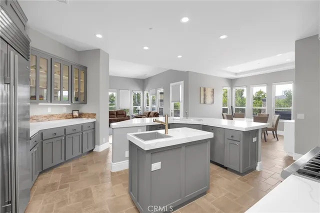 a kitchen with counter top space sink and center island