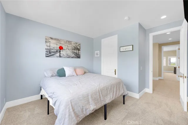a bathroom with a granite countertop sink a mirror and a shower