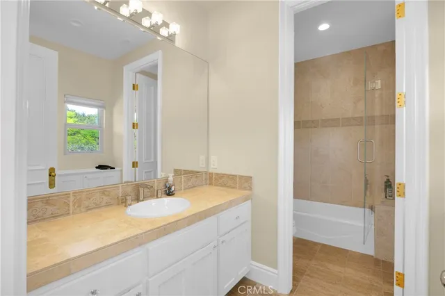 a bath tub sitting next to a shower