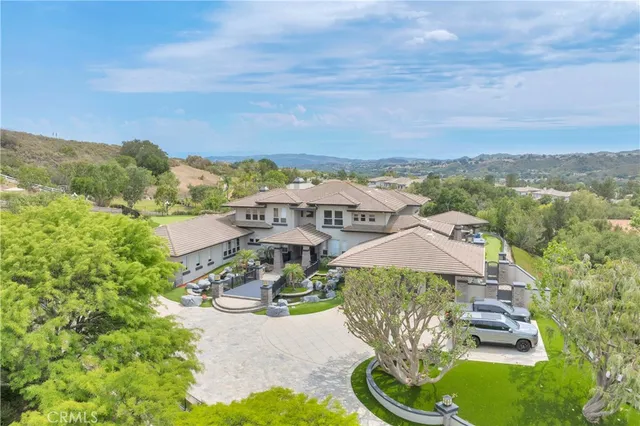 a aerial view of a house with a big yard