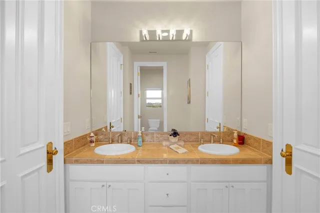 a bathroom with a toilet a sink and bathtub