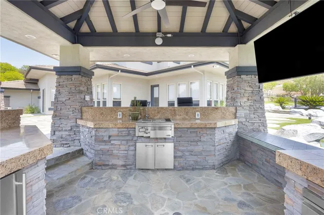 aerial view of a swimming pool with a yard and plants
