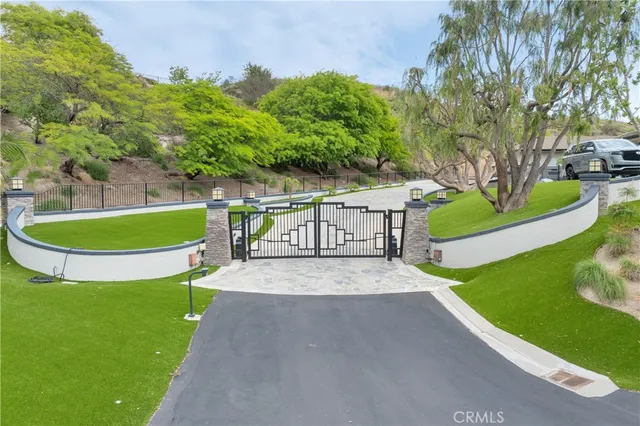 a view of a backyard with swimming pool