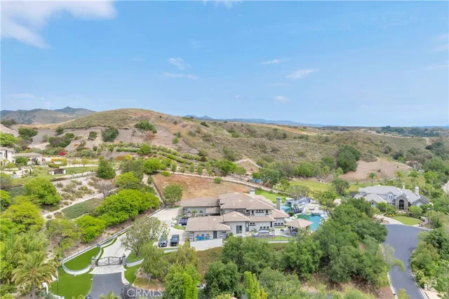 a view of a backyard with plants and a slide