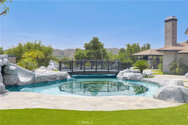 a view of backyard with outdoor seating and green space