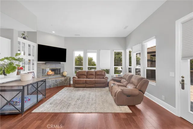 a living room with furniture and kitchen view