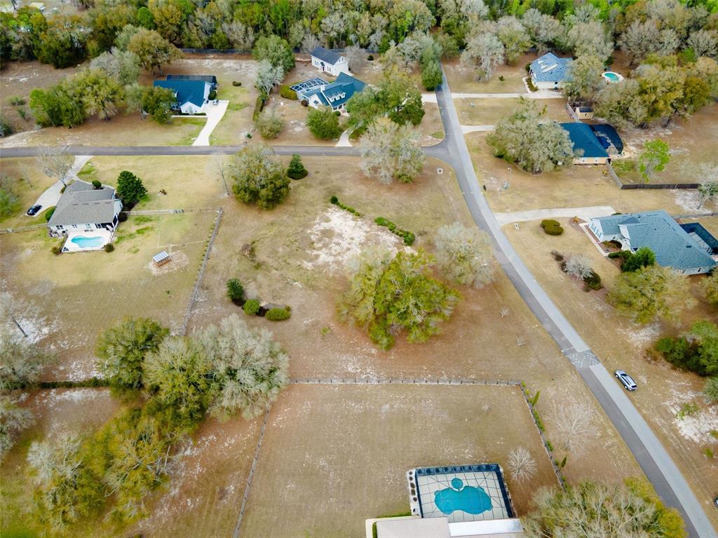 9050 Southwest 84th Street Gainesville, FL 32608 - Photo 8 of 20 a picture of a lake with a building in the background