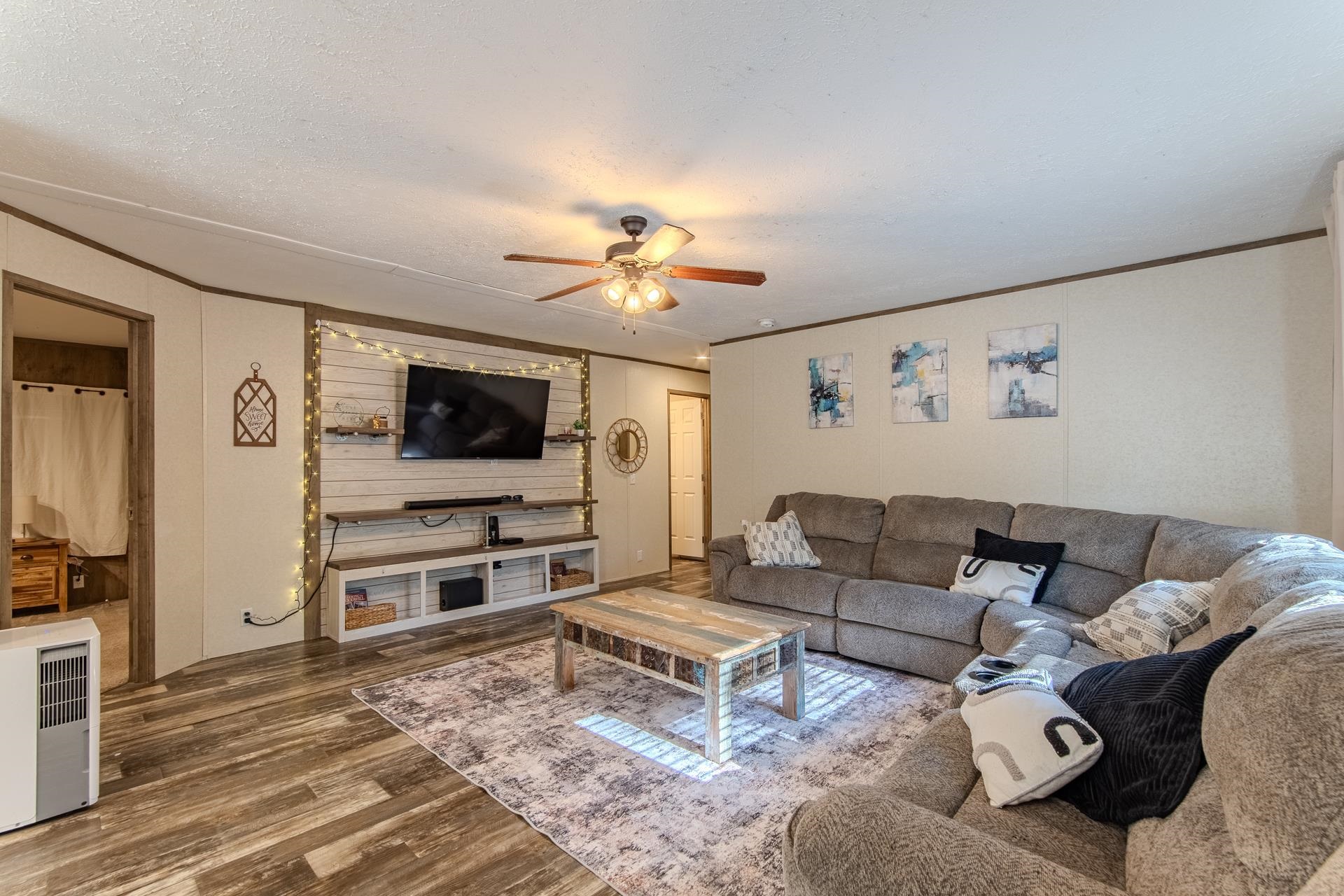 30 Chardonnay Way Counce, TN 38326 - Photo 11 of 37 a living room with furniture and a flat screen tv