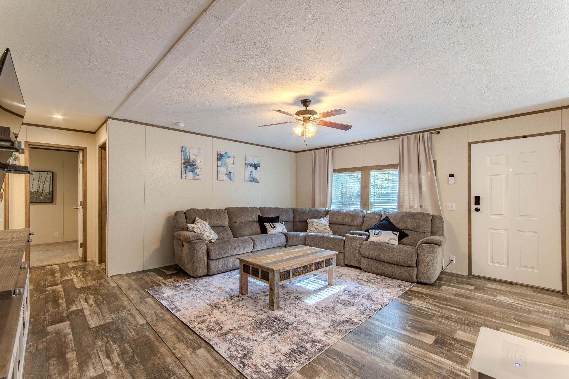 30 Chardonnay Way Counce, TN 38326 - Photo 12 of 37 a living room with furniture and a chandelier
