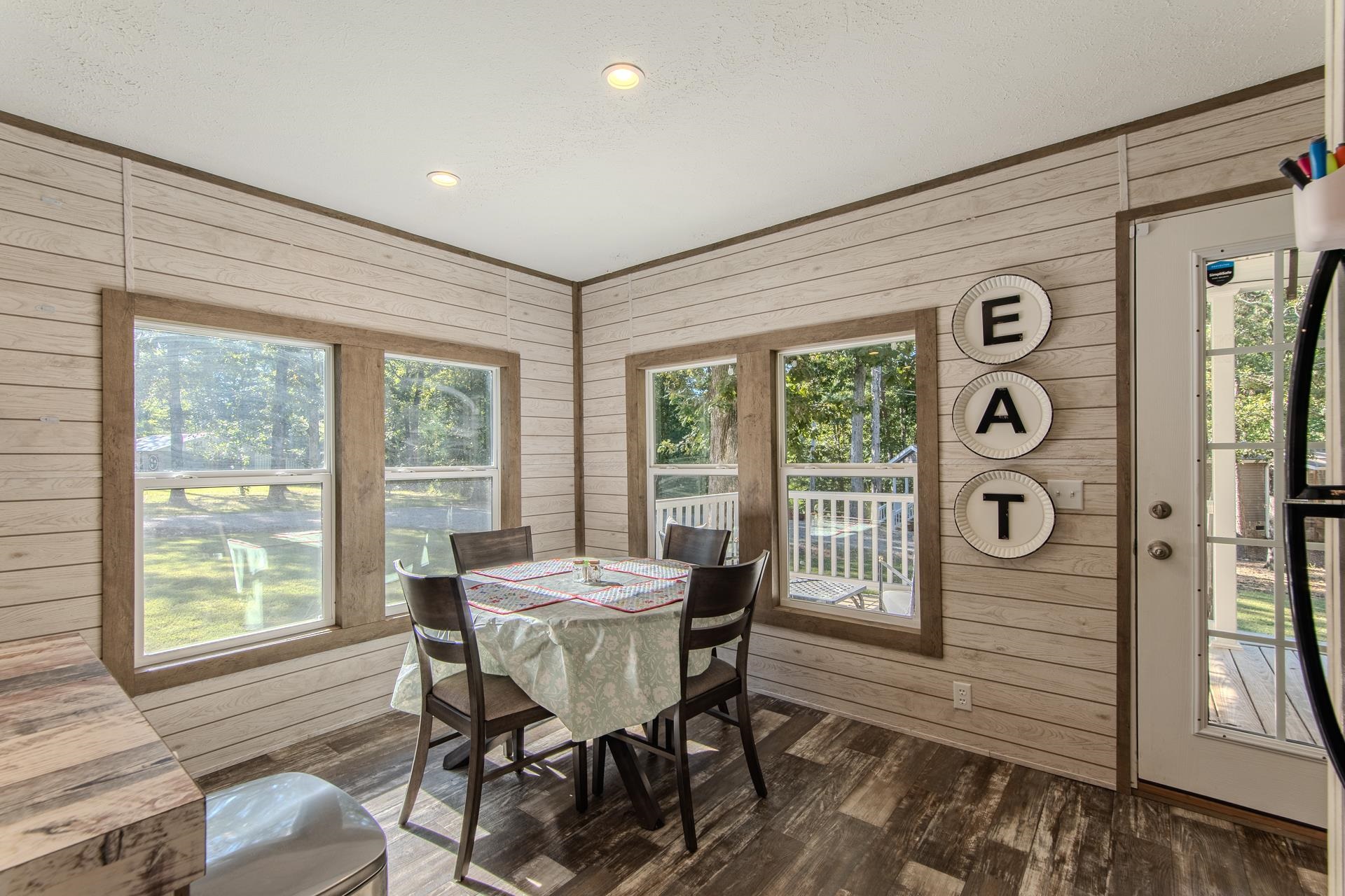 30 Chardonnay Way Counce, TN 38326 - Photo 14 of 37 a view of a dining room with furniture window and wooden floor