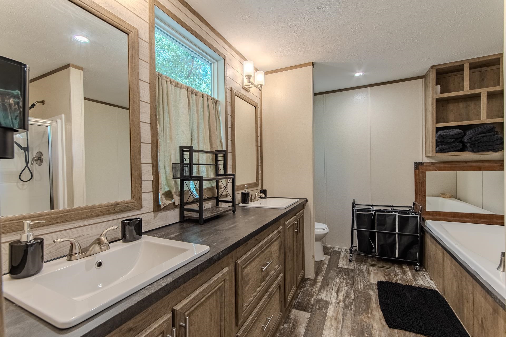 30 Chardonnay Way Counce, TN 38326 - Photo 19 of 37 a bathroom with a double vanity sink a and mirror