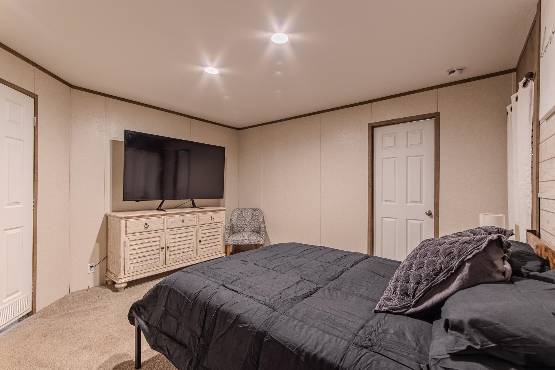30 Chardonnay Way Counce, TN 38326 - Photo 22 of 37 a bedroom with a large bed and flat screen tv