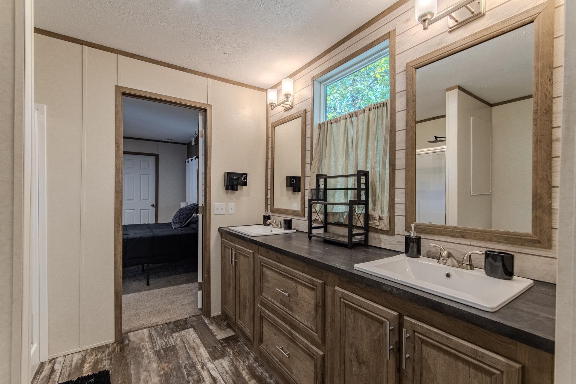 30 Chardonnay Way Counce, TN 38326 - Photo 23 of 37 a bathroom with a double vanity sink and a mirror