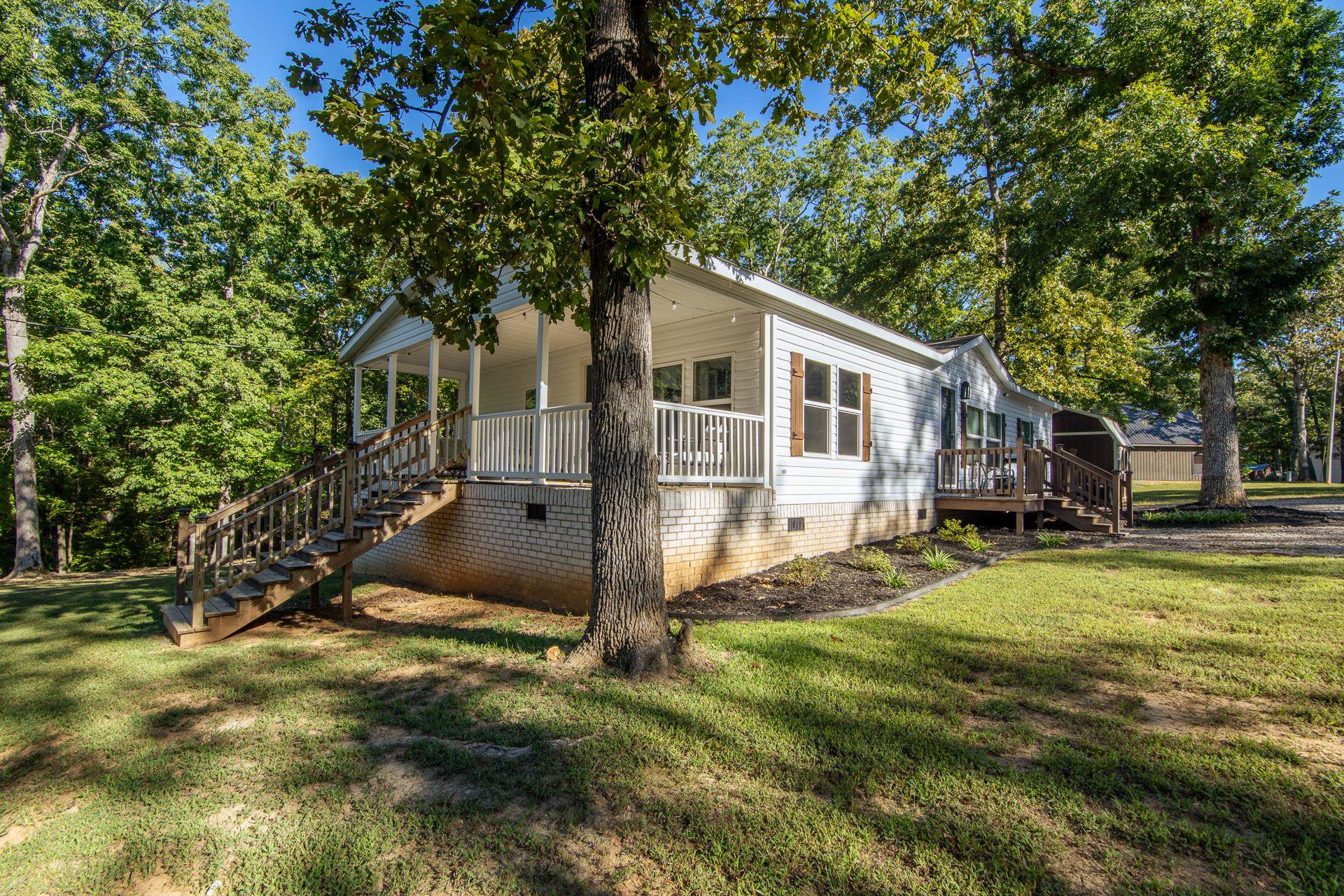 30 Chardonnay Way Counce, TN 38326 - Photo 32 of 37 a view of a house with a yard