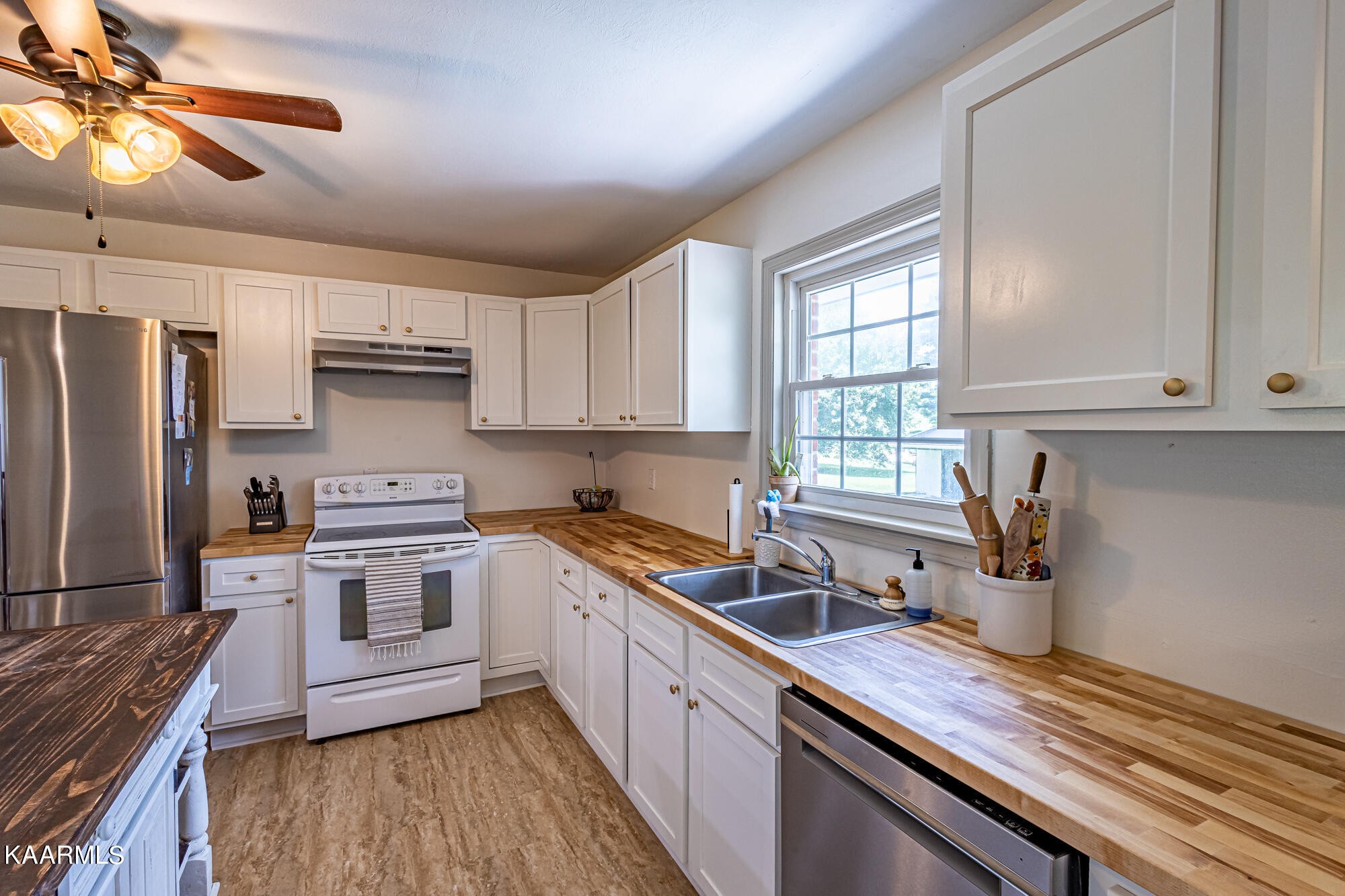 5251 Decatur Highway Ten Mile, TN 37880 - Photo 14 of 49 a kitchen with stainless steel appliances a sink cabinets and wooden floor