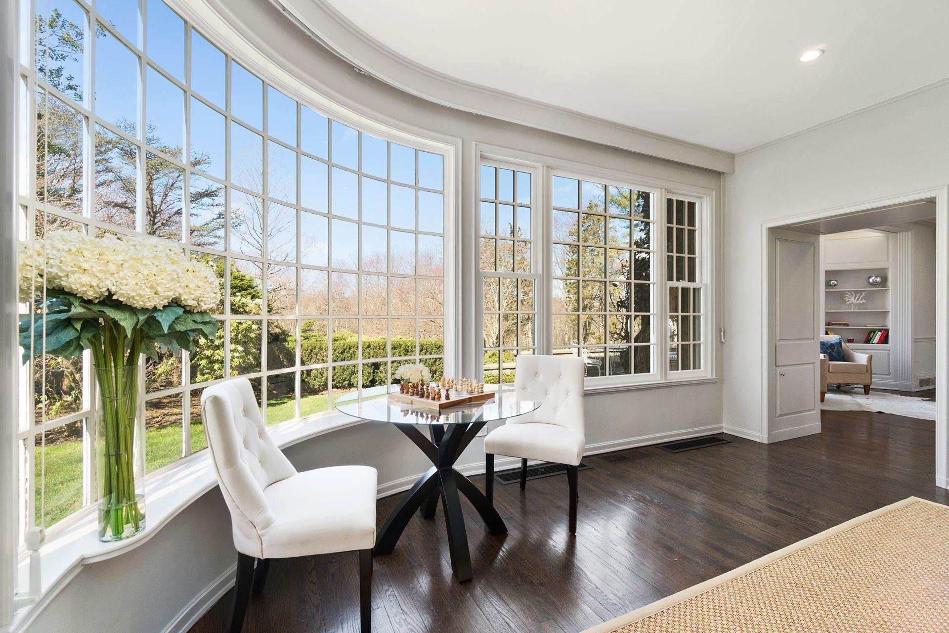 1102 Oenoke Ridge New Canaan, CT 06840 - Photo 12 of 49 a living room with furniture and a window