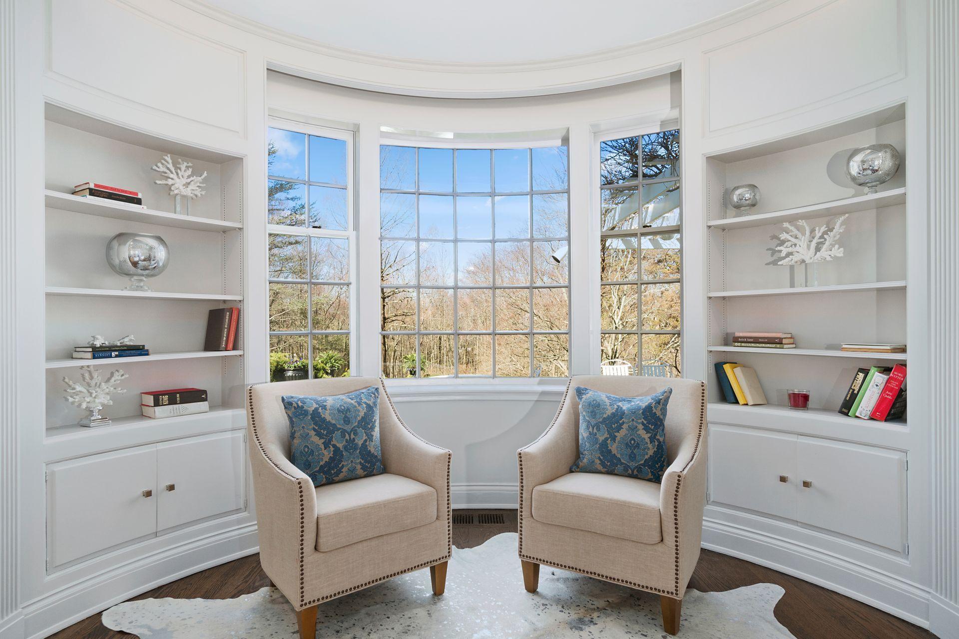 1102 Oenoke Ridge New Canaan, CT 06840 - Photo 14 of 49 a living room with furniture and a window