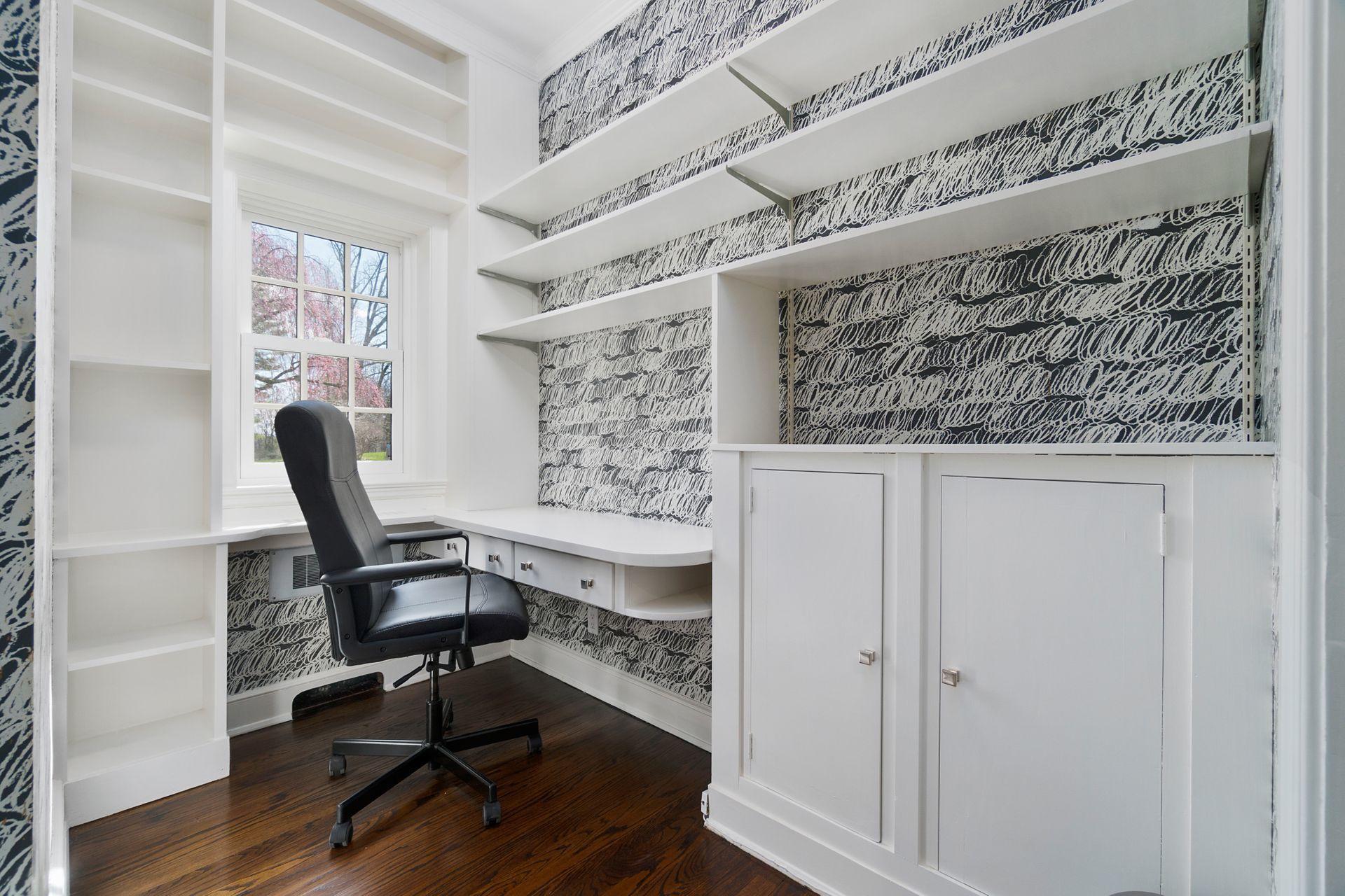 1102 Oenoke Ridge New Canaan, CT 06840 - Photo 19 of 49 a view of a workspace with furniture and a window