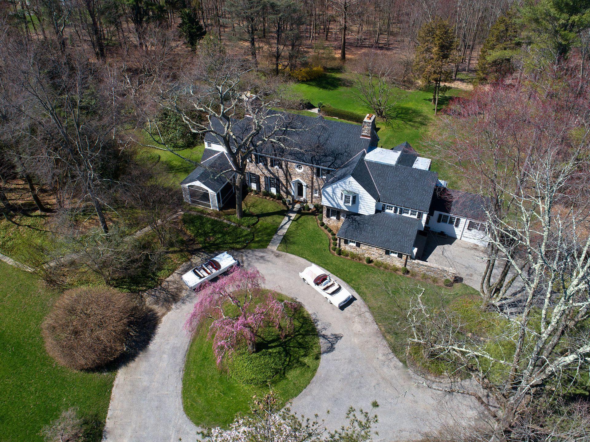 1102 Oenoke Ridge New Canaan, CT 06840 - Photo 2 of 49 an aerial view of a house with a yard