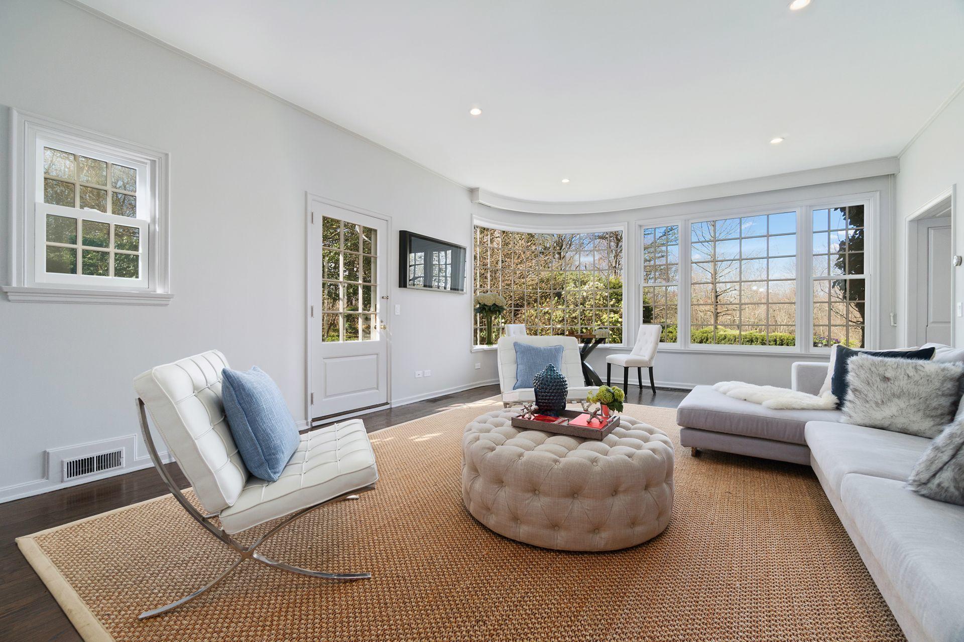 1102 Oenoke Ridge New Canaan, CT 06840 - Photo 21 of 49 a living room with furniture and a large window