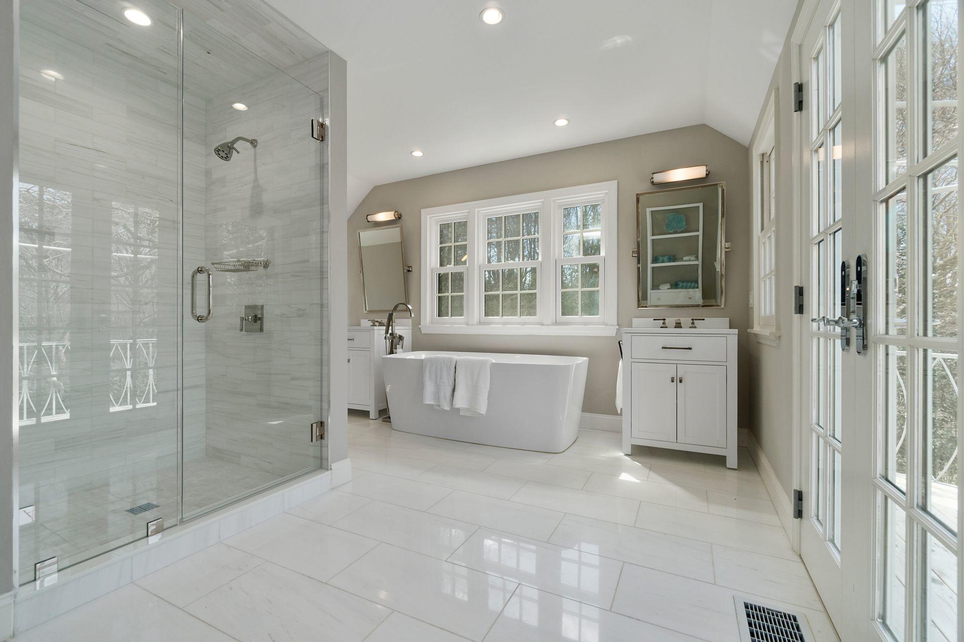 1102 Oenoke Ridge New Canaan, CT 06840 - Photo 23 of 49 a bathroom with a tub sink shower and mirror